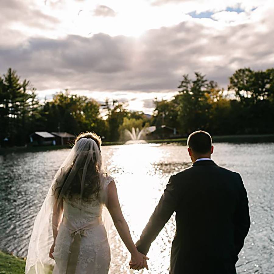 Bride and Groom lookin out over a Lake